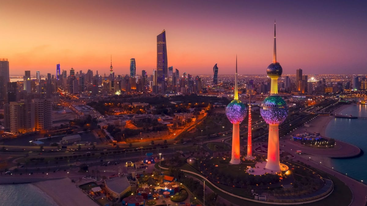 Kuwait City skyline at sunset with the iconic Kuwait Towers, home of Alghanim and Almoayyed Computer Solutions